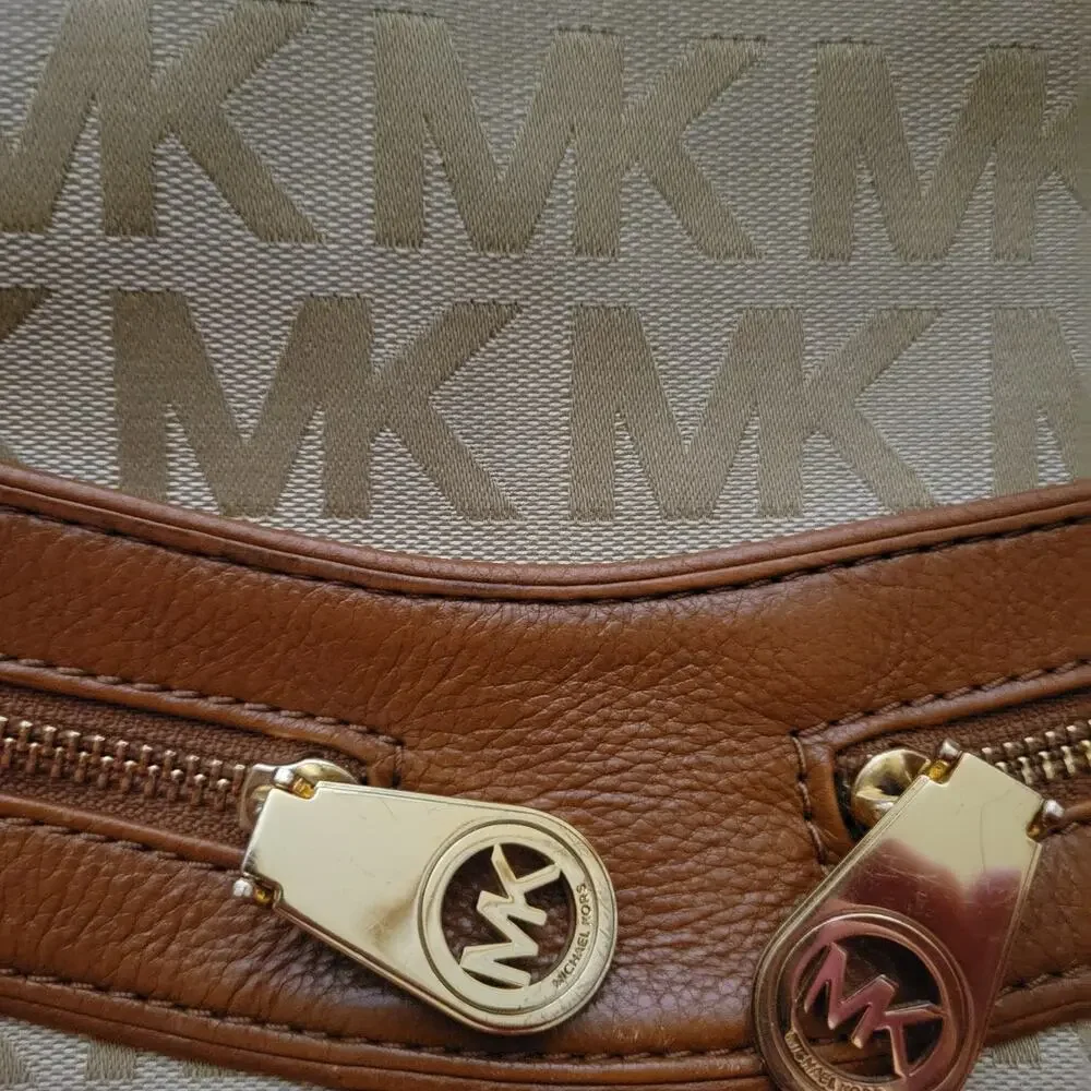 Michael Kors Jamesport Signature Handbag Tab with Leather and Gold Trim Striking